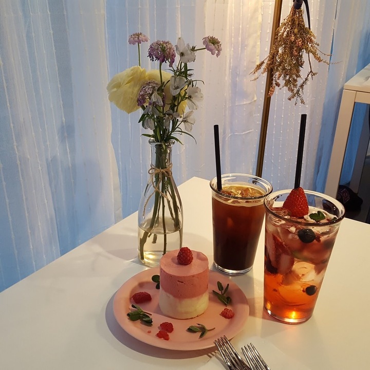 Dear Me Cafe in Mangwon-dong displaying its delicate mousse cakes and tearoom style dessert plating